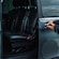 A private driver opening the door of a luxury van
